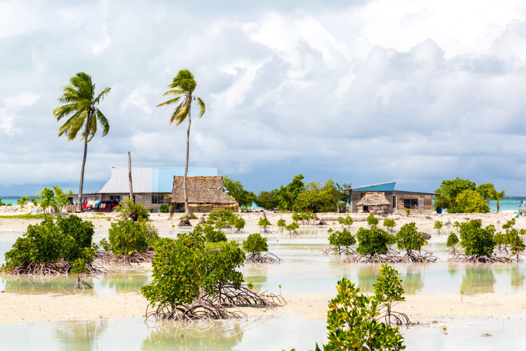 Sea level rise is encroaching on the land of a Kiribati island.
